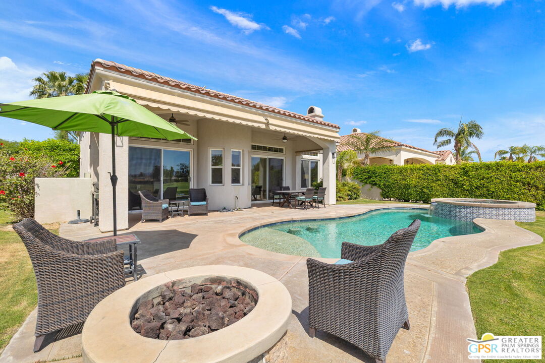 88 Vía Las Flores Rancho Mirage, CA 92270 - Photo 57 of 65 a view of a patio with swimming pool table and chairs