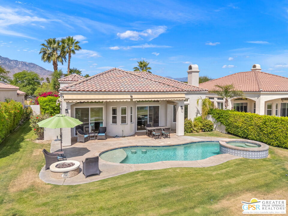 88 Vía Las Flores Rancho Mirage, CA 92270 - Photo 59 of 65 a front view of a house with a yard table and chairs