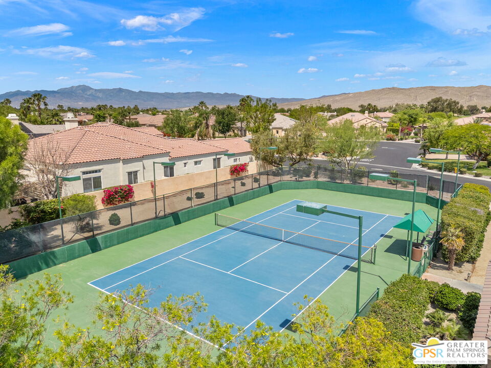 88 Vía Las Flores Rancho Mirage, CA 92270 - Photo 60 of 65 an aerial view of a tennis ground and a city view