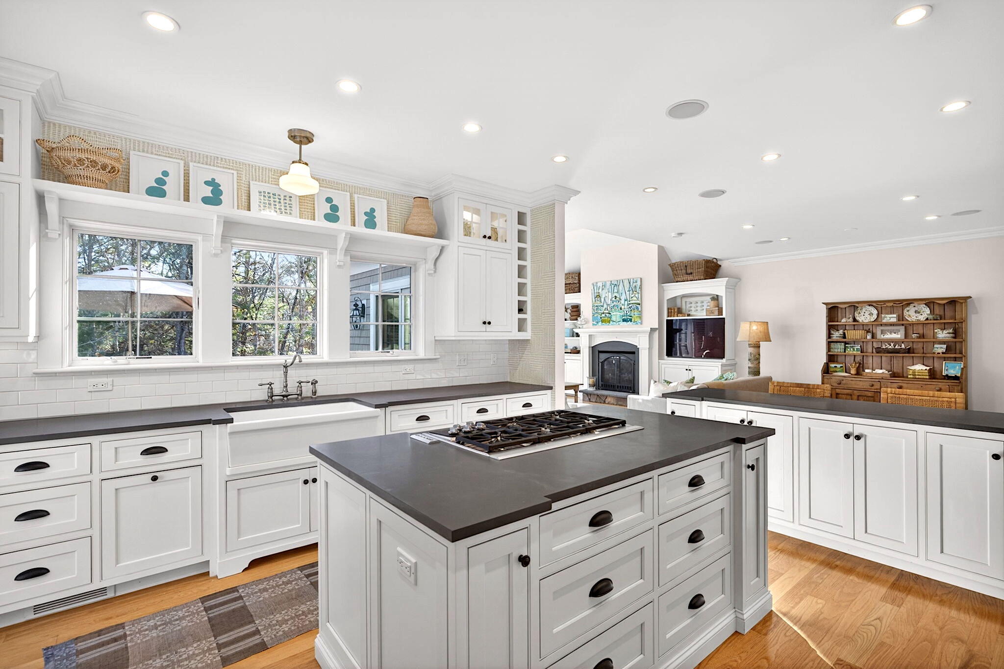 205 Little River Road Cotuit, MA 02635 - Photo 14 of 60 a kitchen with granite countertop stove a sink and dishwasher with wooden floor