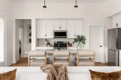 a kitchen with appliances a sink and a counter space