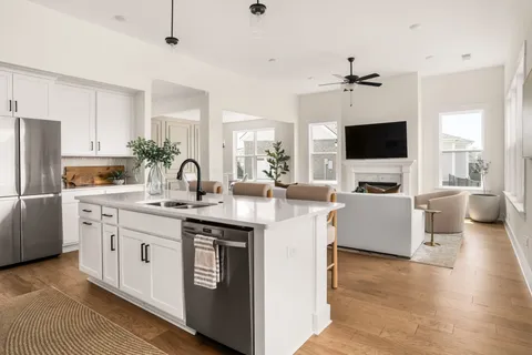 a utility room with sink dryer and washer