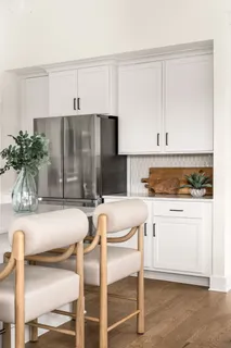 a spacious bedroom with a bed and a window