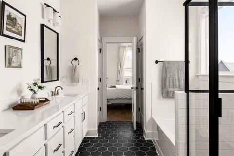 a spacious bedroom with a bed and a window