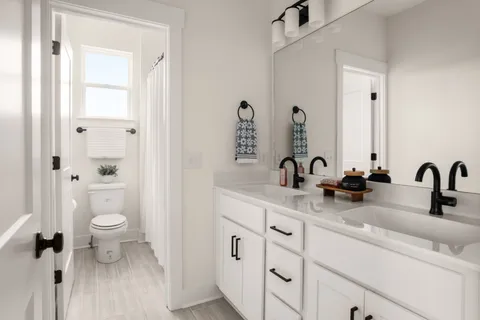 an aerial view of a house with outdoor space