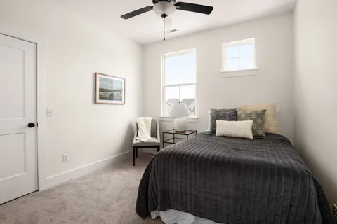 a front view of a house with a yard table and chairs