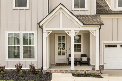 a view of a livingroom with furniture and windows