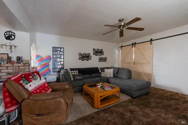 a living room with furniture and rug