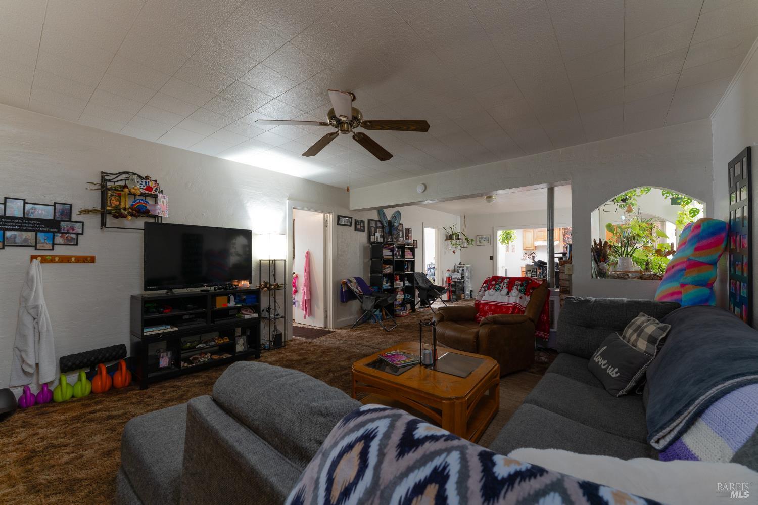 38 South Main Street Willits, CA 95490 - Photo 35 of 88 a living room with furniture and a flat screen tv