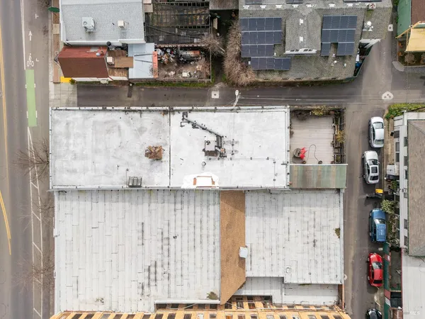 an aerial view of residential building with parking space