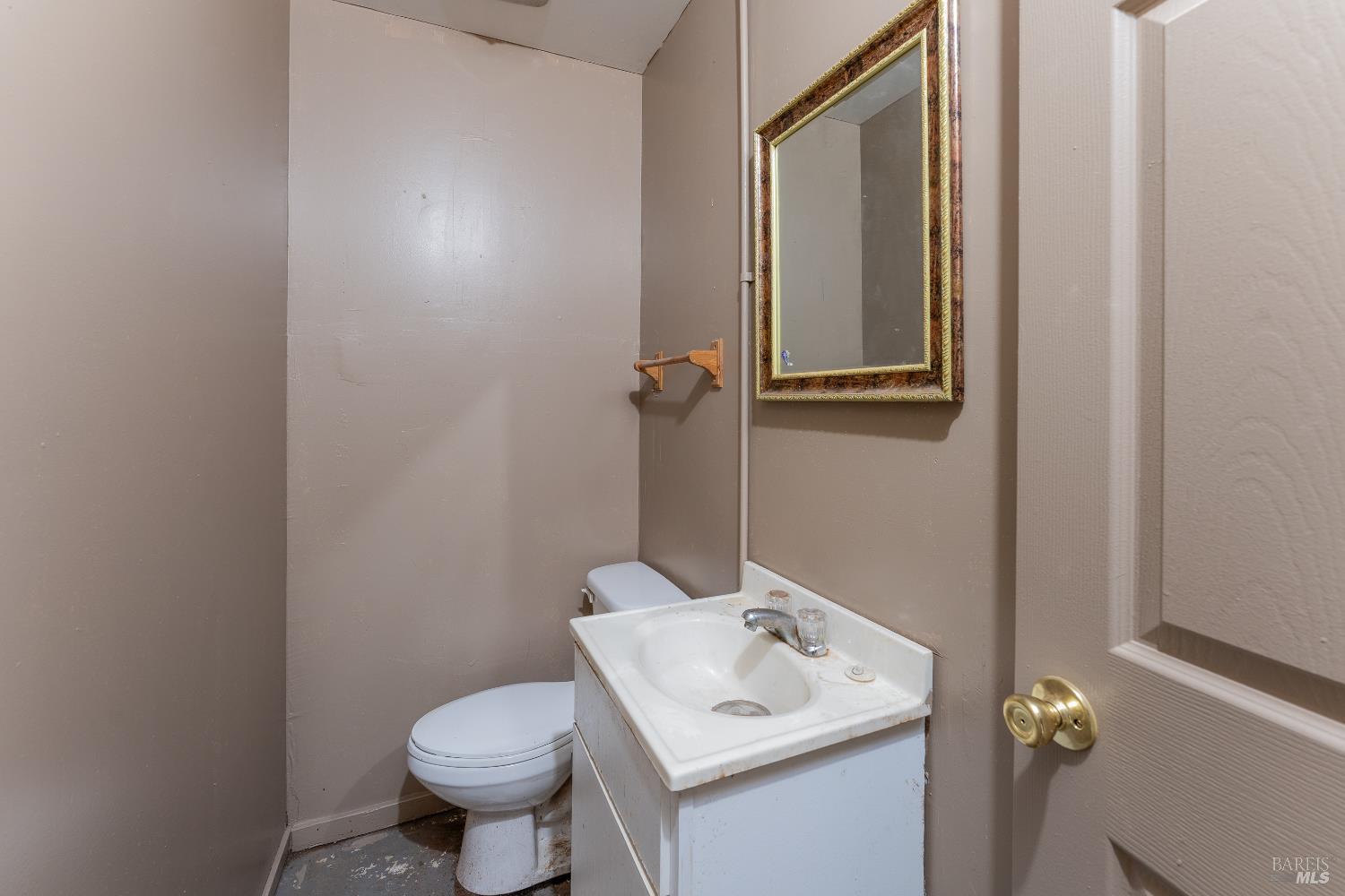 38 South Main Street Willits, CA 95490 - Photo 84 of 88 a bathroom with a toilet sink and mirror