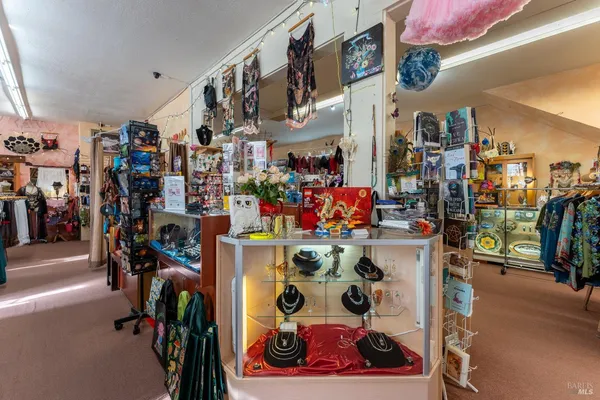 a view of walk in closet with clothes