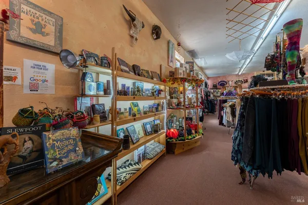 a bathroom with a toilet a sink and shower