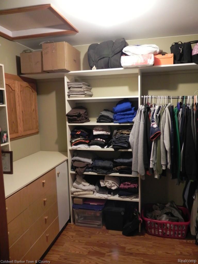 4950 Meridian Road Williamston, MI 48895 - Photo 29 of 34 Walk in closet in master bedroom