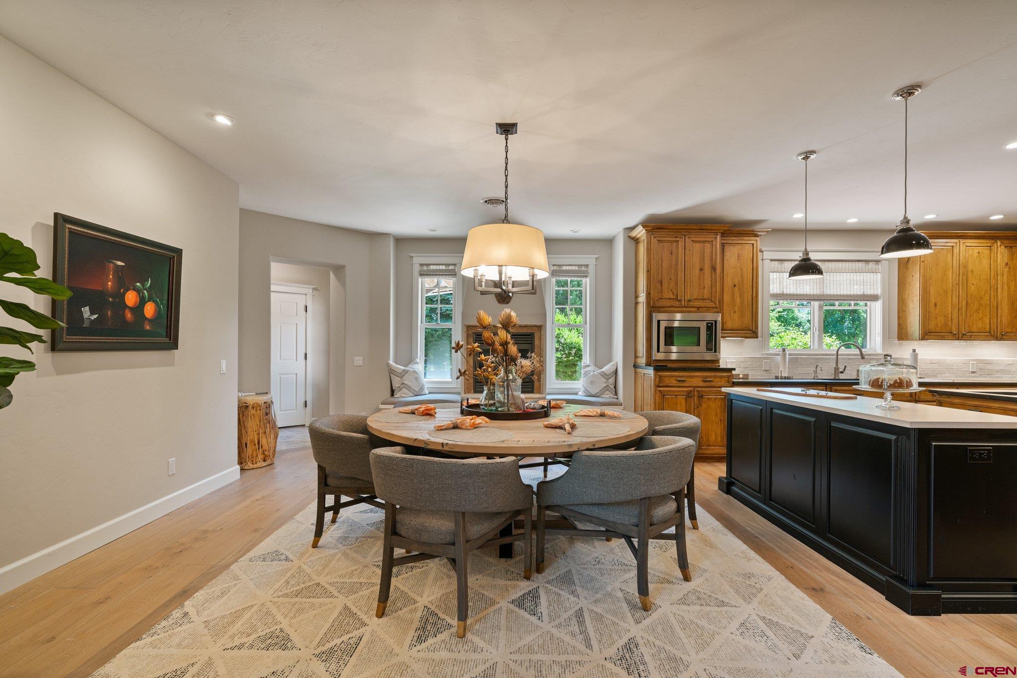 385 Red Rock Road Durango, CO 81301 - Photo 12 of 35 a view of a dining room with furniture window and wooden floor