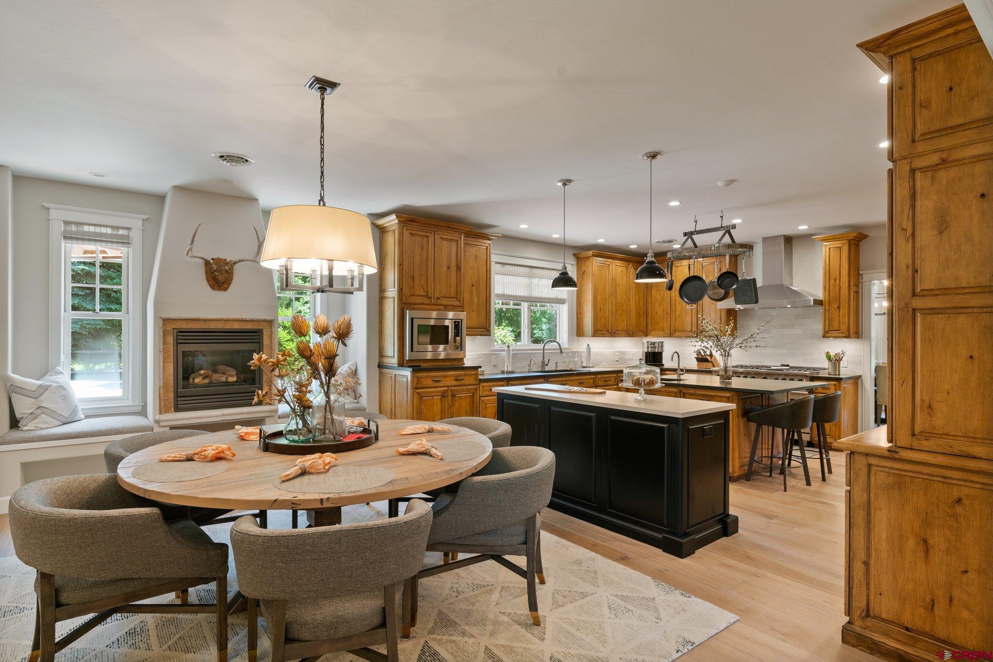 385 Red Rock Road Durango, CO 81301 - Photo 13 of 35 a kitchen with a dining table and chairs