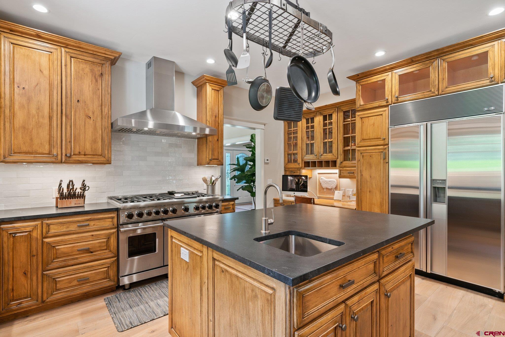 385 Red Rock Road Durango, CO 81301 - Photo 18 of 35 a kitchen with stainless steel appliances granite countertop a sink a stove and a refrigerator