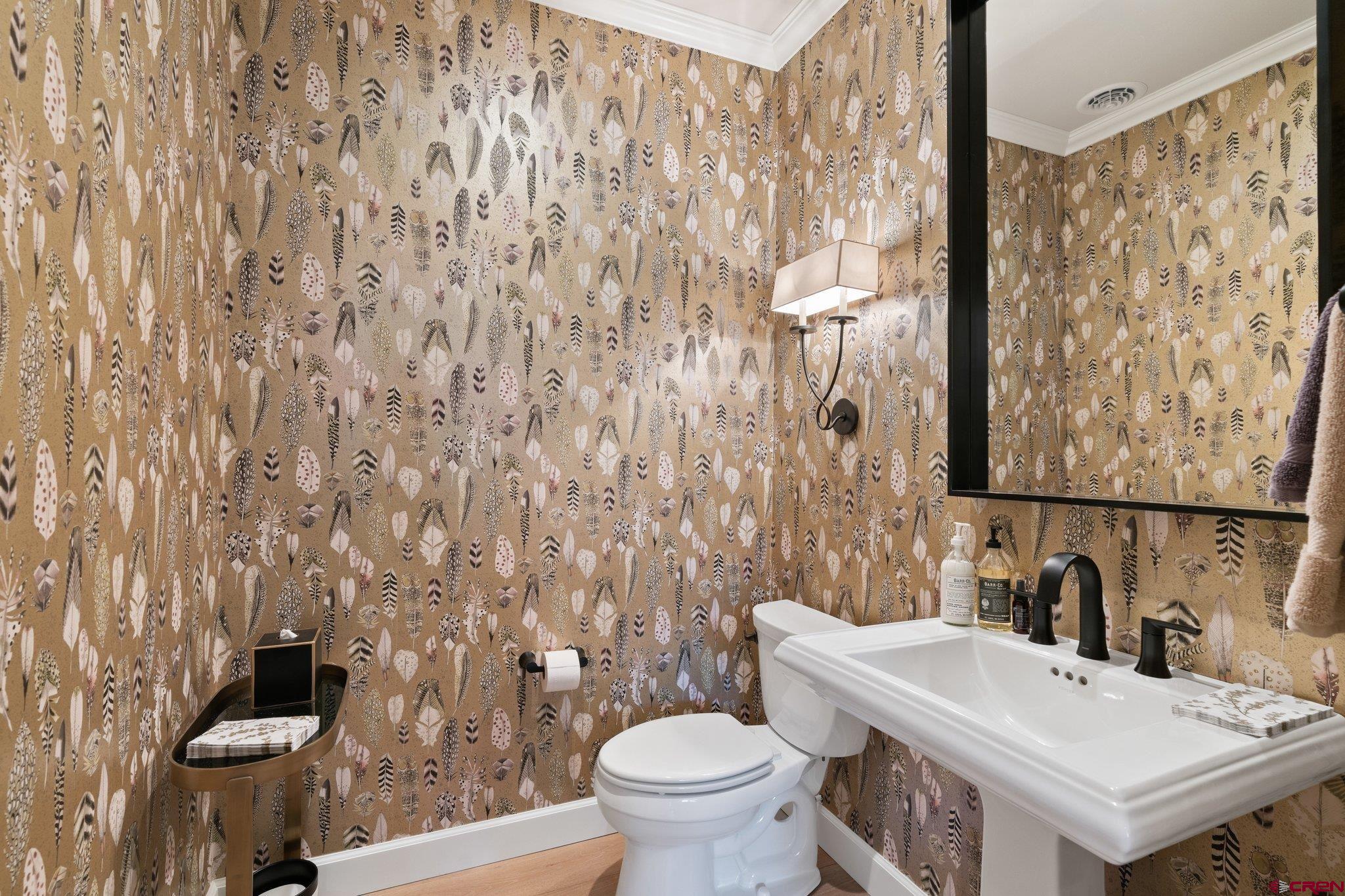 385 Red Rock Road Durango, CO 81301 - Photo 21 of 35 a bathroom with a sink a toilet and a mirror