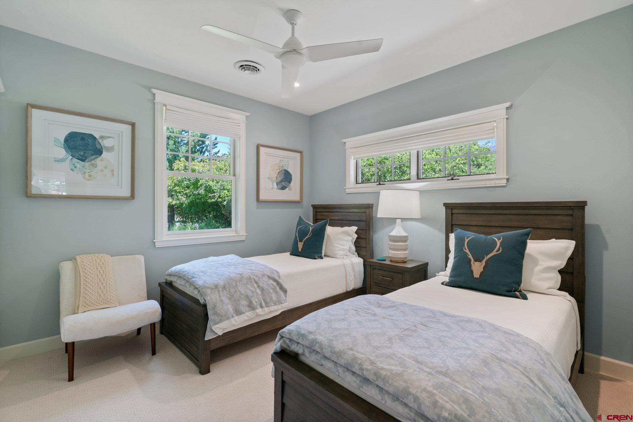 385 Red Rock Road Durango, CO 81301 - Photo 29 of 35 a bedroom with two beds and a window