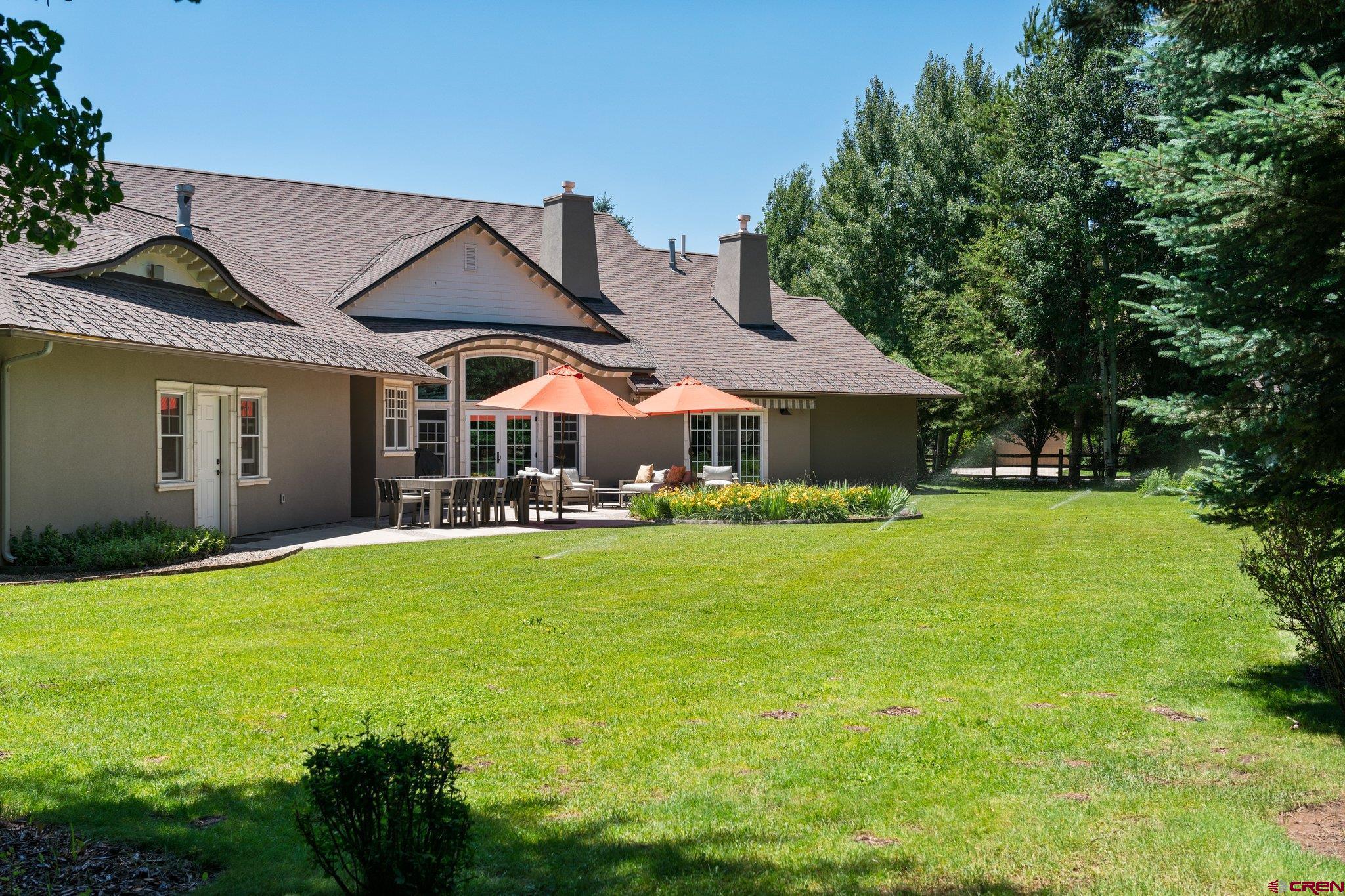 385 Red Rock Road Durango, CO 81301 - Photo 32 of 35 a front view of a house with a garden and porch
