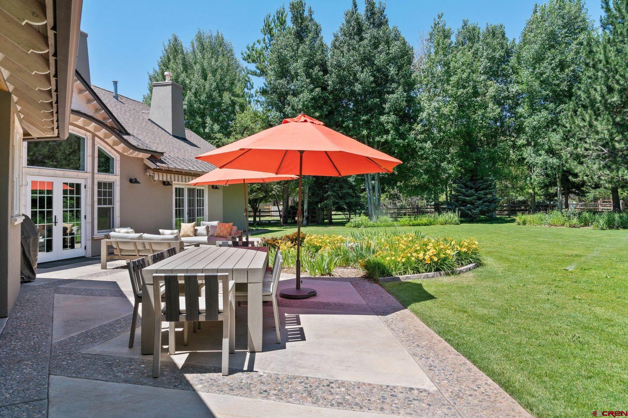 385 Red Rock Road Durango, CO 81301 - Photo 33 of 35 a view of backyard with patio and garden