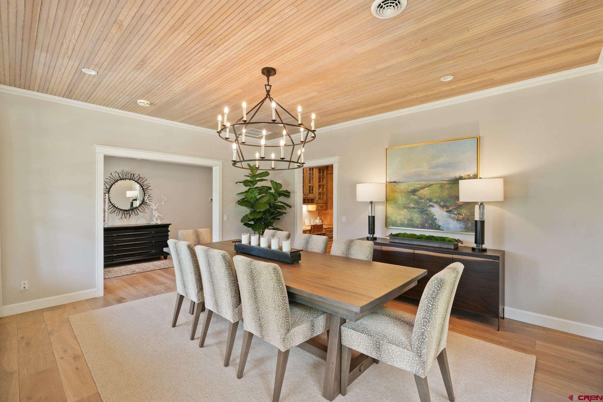 385 Red Rock Road Durango, CO 81301 - Photo 6 of 35 a view of a dining room with furniture and chandelier