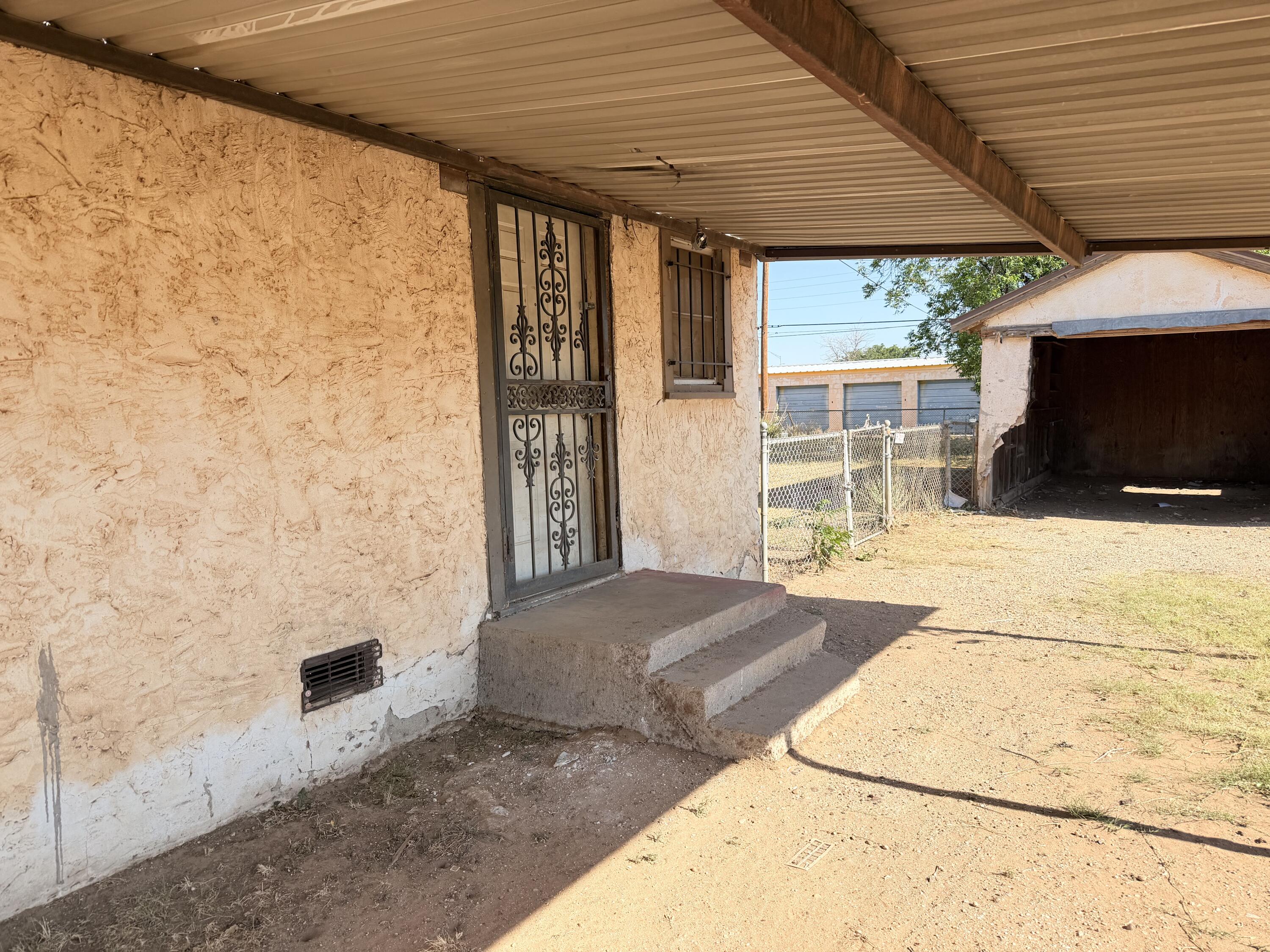 1612 46th Street Lubbock, TX 79412 - Photo 3 of 3 a bedroom with a bed and a flat screen tv