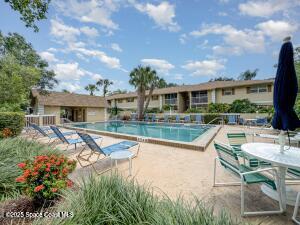 1609 Sunny Brook Lane, Unit E201 Palm Bay, FL 32905 - Photo 15 of 15 a view of a house with backyard and sitting area