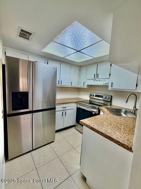1609 Sunny Brook Lane, Unit E201 Palm Bay, FL 32905 - Photo 2 of 15 a kitchen with stainless steel appliances granite countertop a refrigerator sink and cabinets