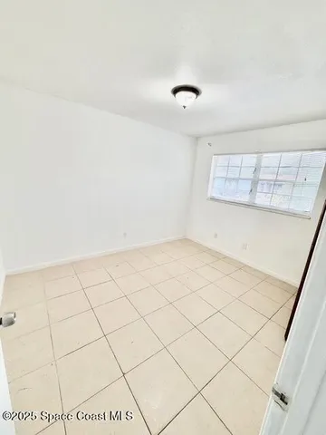 a view of a room with white walls