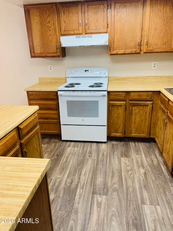 a kitchen with a stove and a sink
