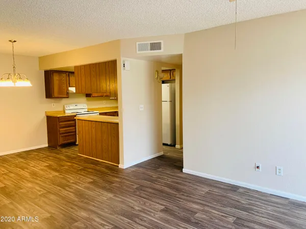 a view of a kitchen with wooden floor