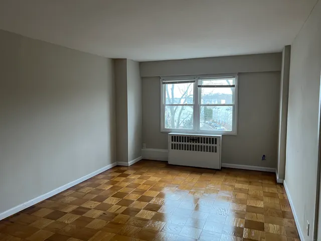 a view of a room that has a window in it