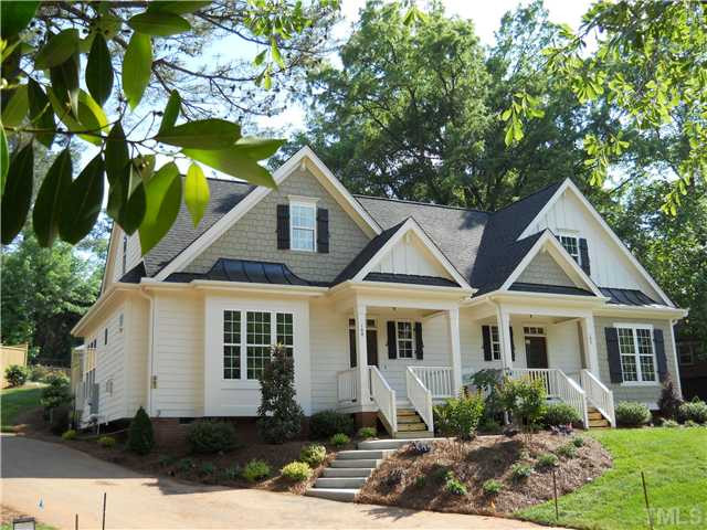 2603 Wayland Drive, Unit 102 Raleigh, NC 27608 - Photo 1 of 11 Charming cottage style architecture includes all the details one expects: board&batten, standing seam metal, shakes, wood shutters and true divided twelve-lite front door. You'll also enjoy low maintenance fiber cement siding and 30-year shingles. Exterior Front