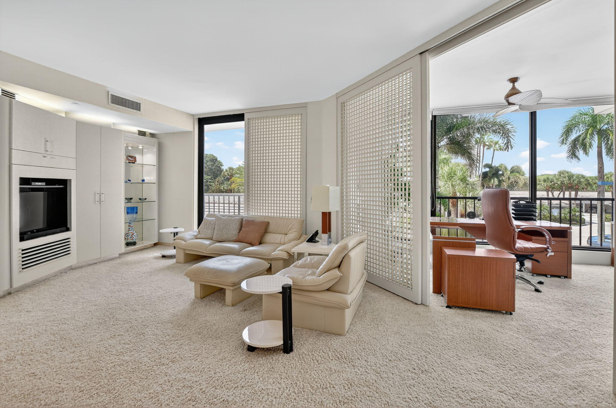 20310 Fairway Oaks Drive, Unit 124 Boca Raton, FL 33434 - Photo 12 of 65 a living room with furniture and large windows