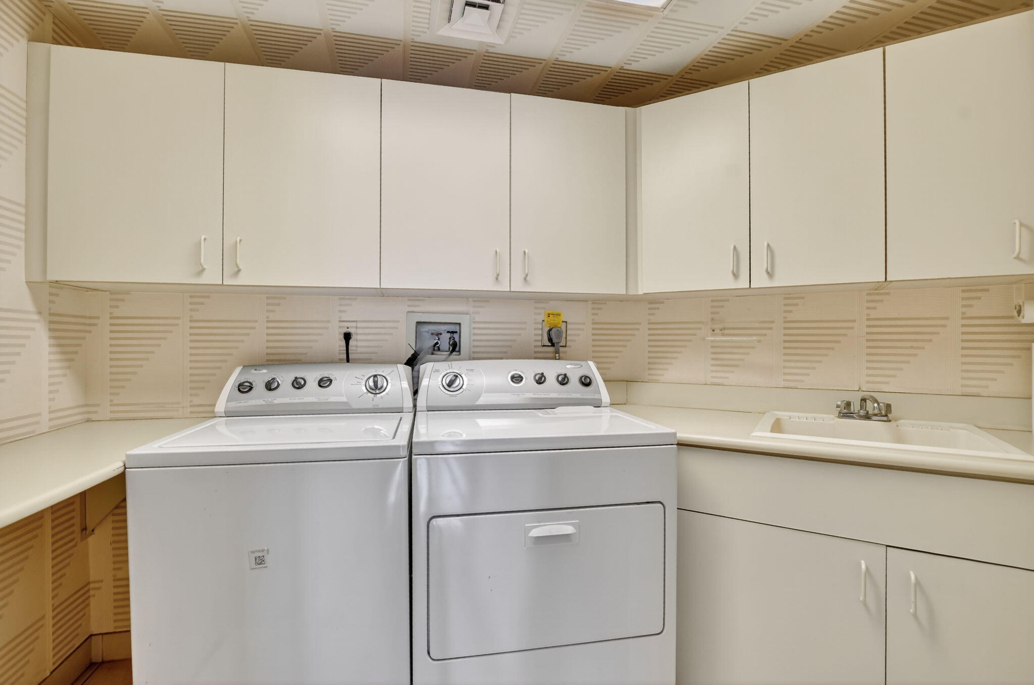 20310 Fairway Oaks Drive, Unit 124 Boca Raton, FL 33434 - Photo 14 of 65 a view of storage and utility room with washer and dryer