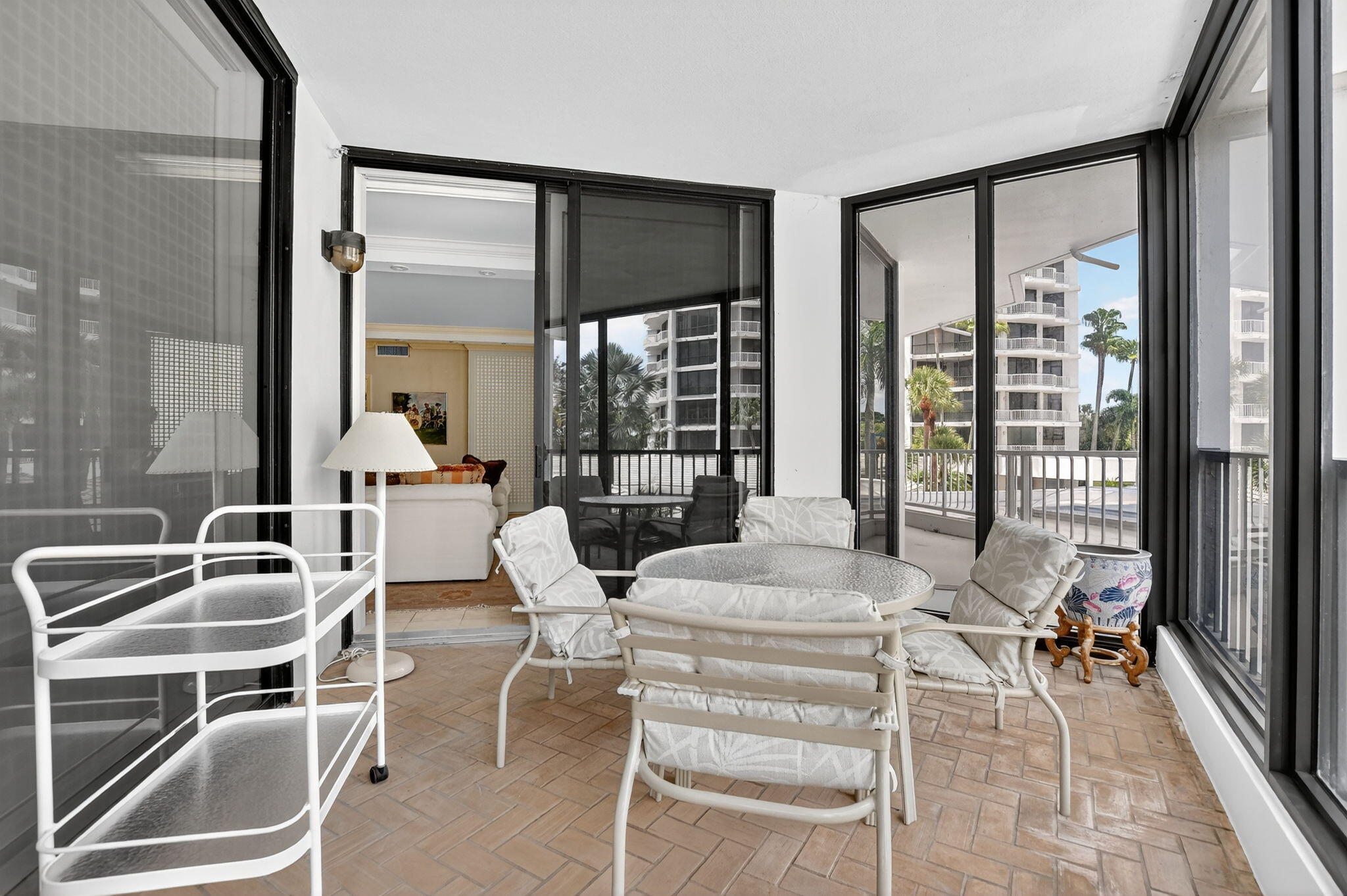 20310 Fairway Oaks Drive, Unit 124 Boca Raton, FL 33434 - Photo 15 of 65 a living room with furniture a large window and wooden floor