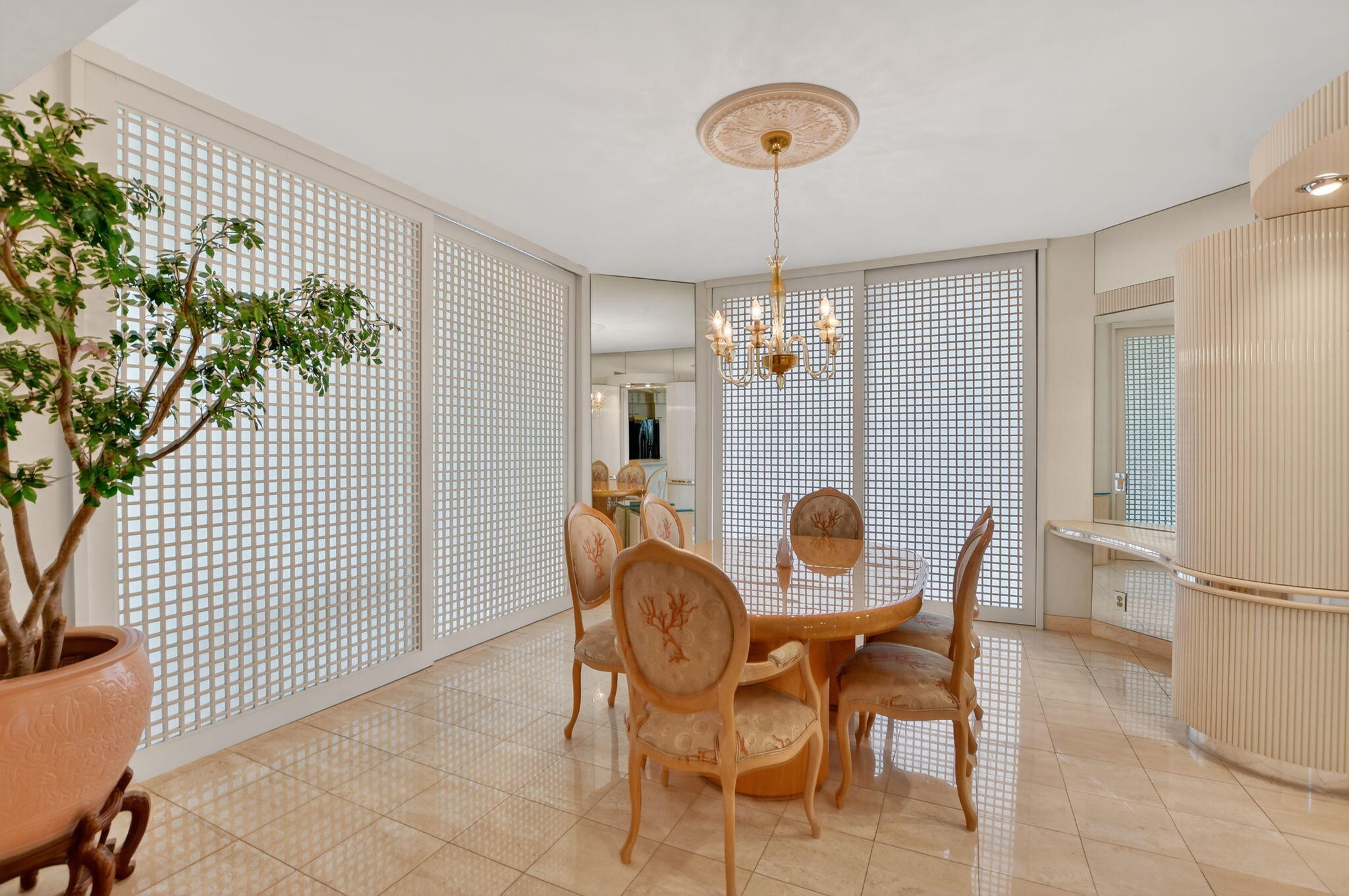 20310 Fairway Oaks Drive, Unit 124 Boca Raton, FL 33434 - Photo 17 of 65 a view of a dining room with furniture and chandelier