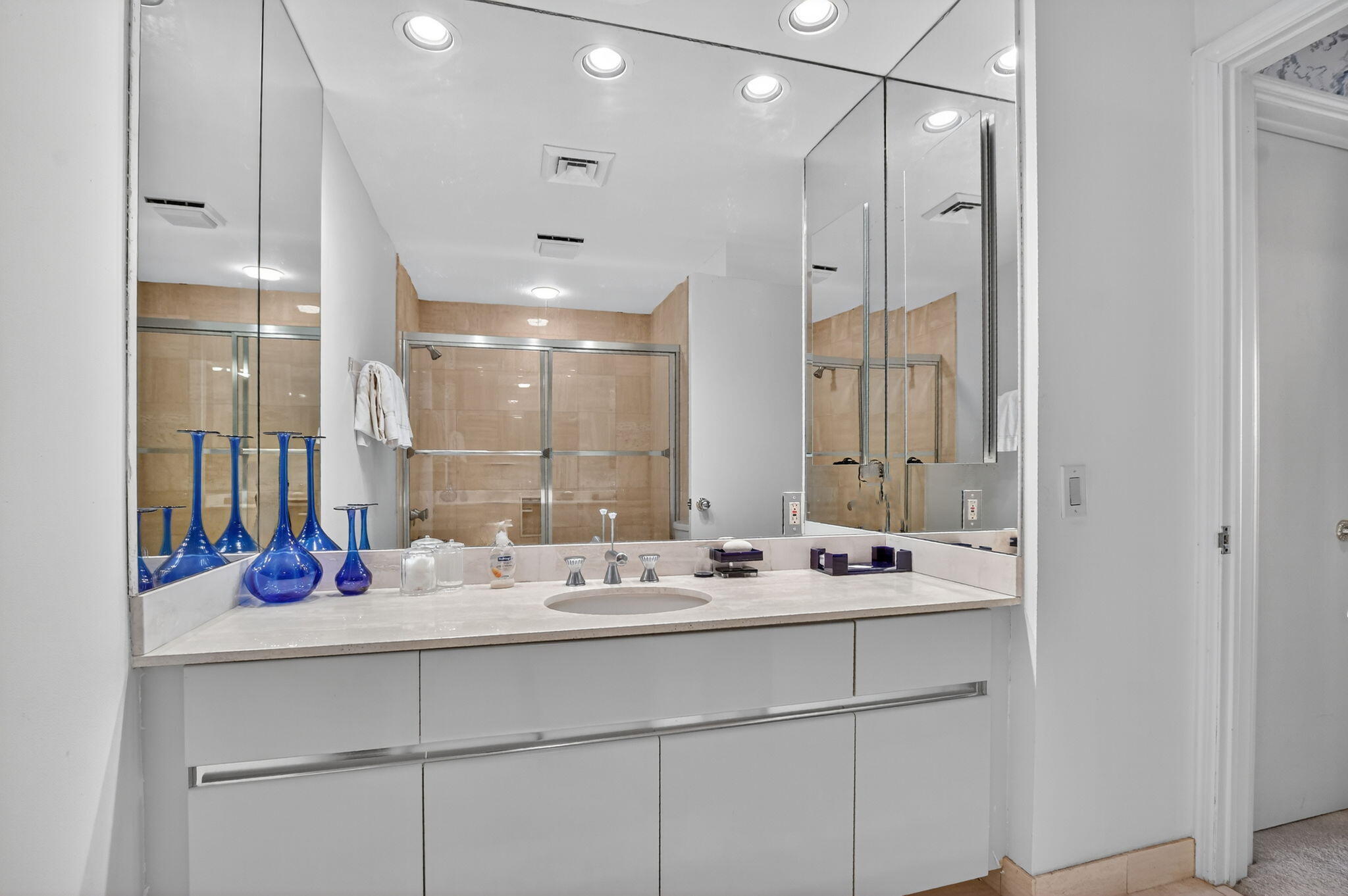 20310 Fairway Oaks Drive, Unit 124 Boca Raton, FL 33434 - Photo 22 of 65 a bathroom with a sink double vanity and shower