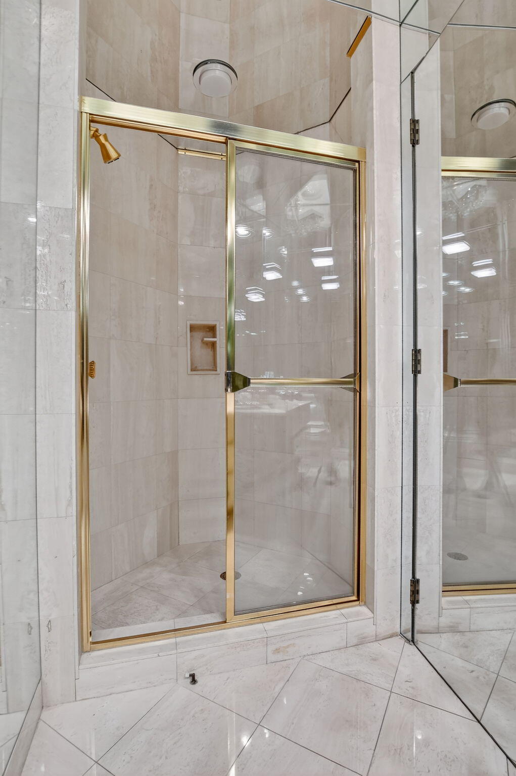 20310 Fairway Oaks Drive, Unit 124 Boca Raton, FL 33434 - Photo 26 of 65 a bathroom with a glass shower door