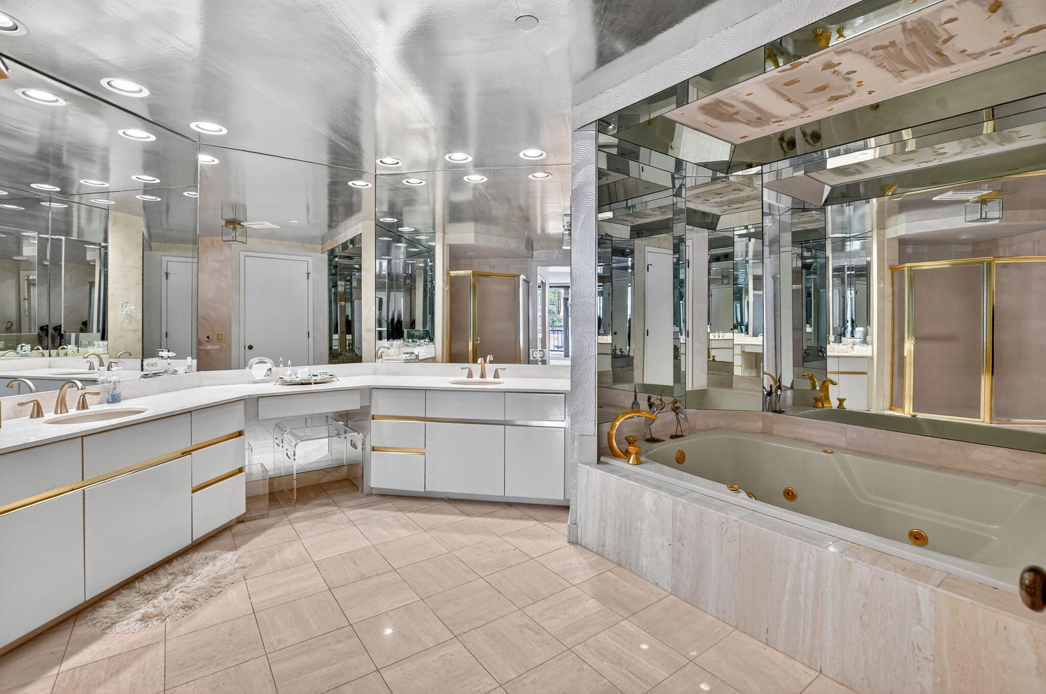 20310 Fairway Oaks Drive, Unit 124 Boca Raton, FL 33434 - Photo 30 of 65 a large white bathroom with a large tub sink and double vanity