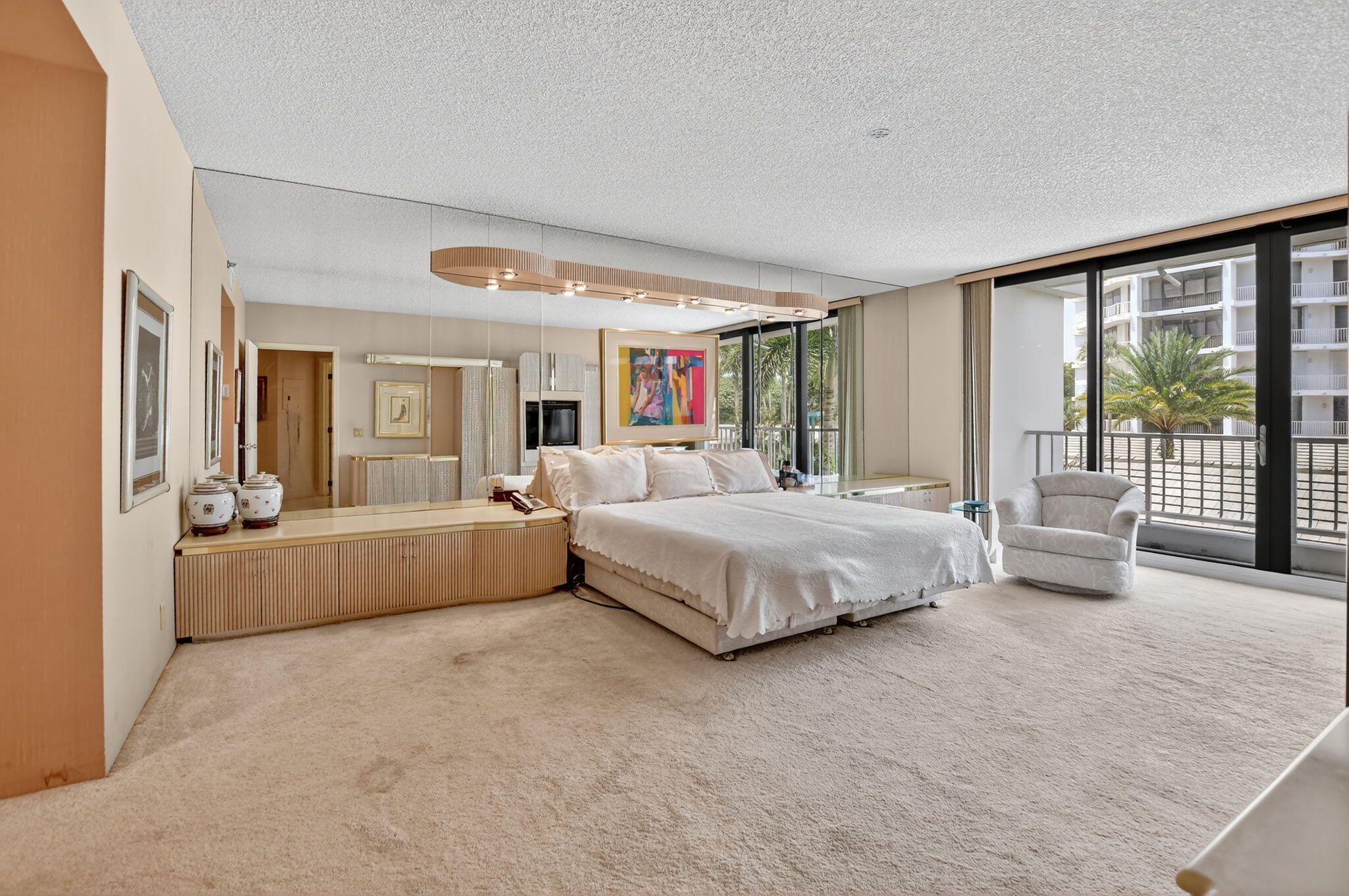 20310 Fairway Oaks Drive, Unit 124 Boca Raton, FL 33434 - Photo 3 of 65 a spacious bedroom with a large bed and a large window