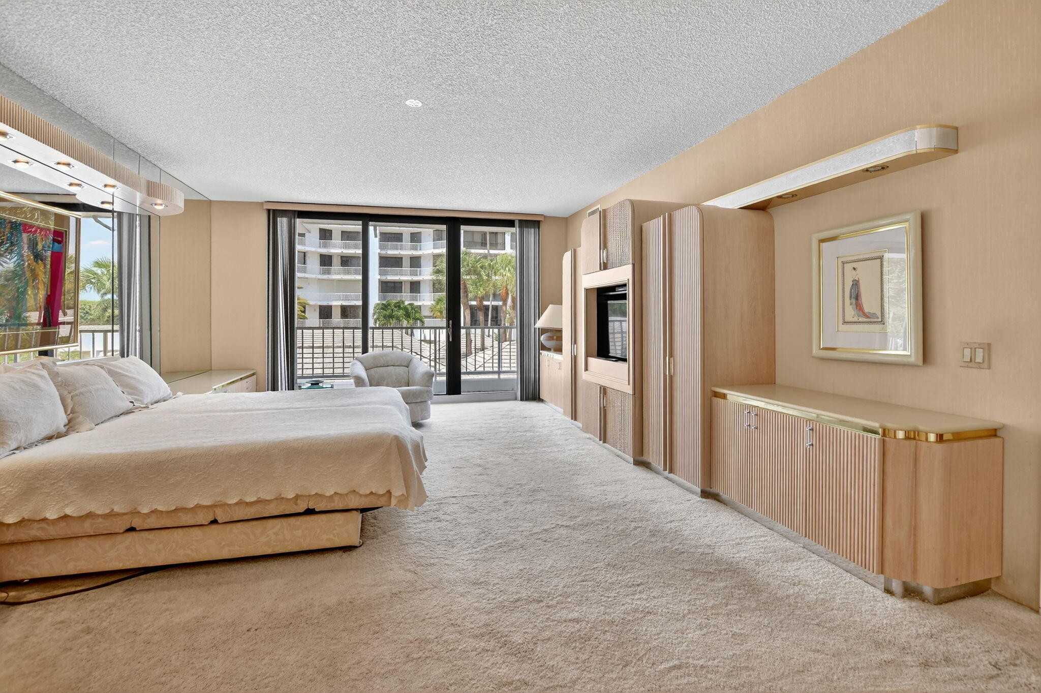 20310 Fairway Oaks Drive, Unit 124 Boca Raton, FL 33434 - Photo 31 of 65 a spacious bedroom with a large bed and a large window