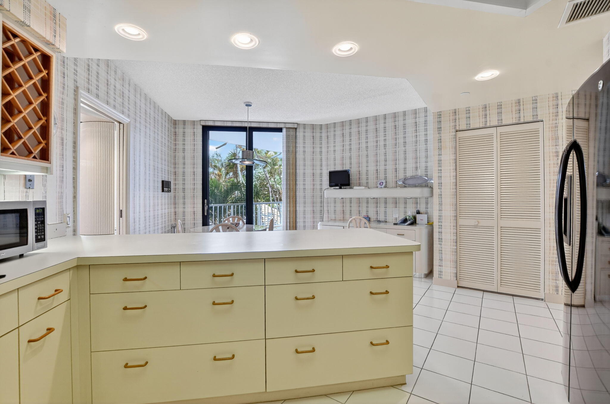 20310 Fairway Oaks Drive, Unit 124 Boca Raton, FL 33434 - Photo 37 of 65 a view of cabinets a washer and dryer