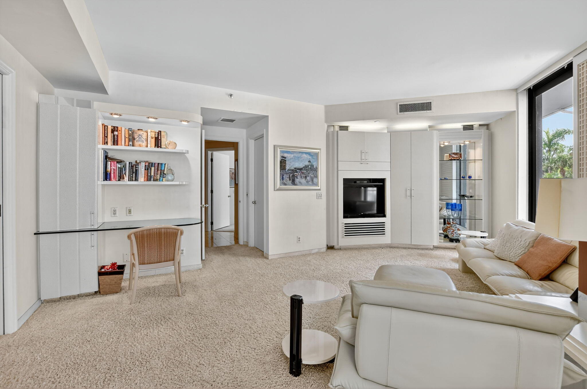 20310 Fairway Oaks Drive, Unit 124 Boca Raton, FL 33434 - Photo 45 of 65 a living room with furniture and a table