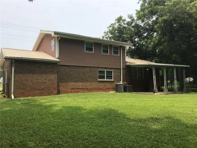 a view of a backyard of the house