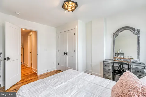 a bedroom with a bed and a table in it
