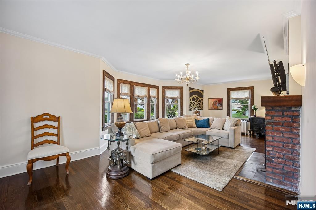 57 Oldis Street Rochelle Park, NJ 07662 - Photo 4 of 19 a living room with furniture fireplace and wooden floor