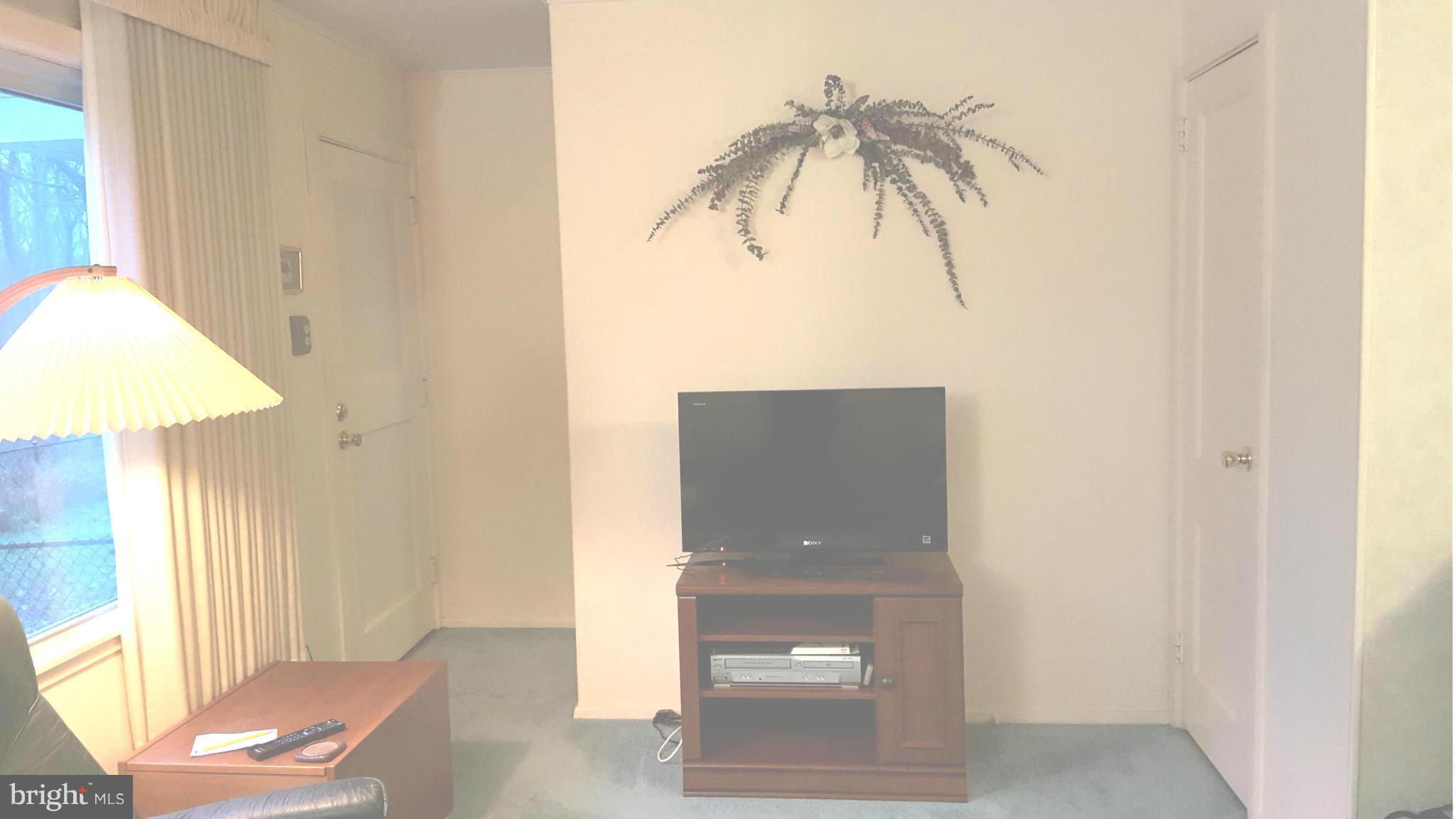 36 Ridge Road, Unit E Greenbelt, MD 20770 - Photo 5 of 13 Living room entry