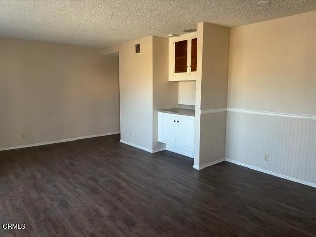 a view of a livingroom with wooden floor
